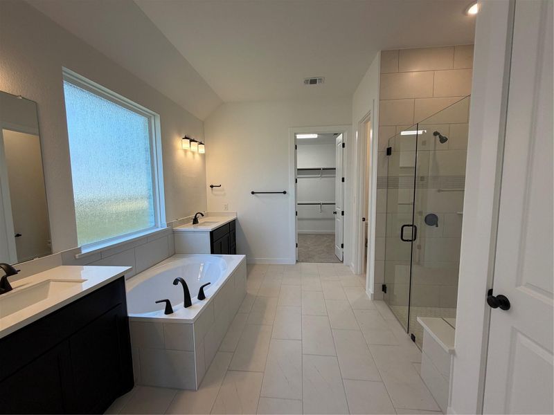 Primary Bath retreat with dual vanities, garden tub & walk-in shower Primary Bath retreat with dual vanities, garden tub & walk-in shower