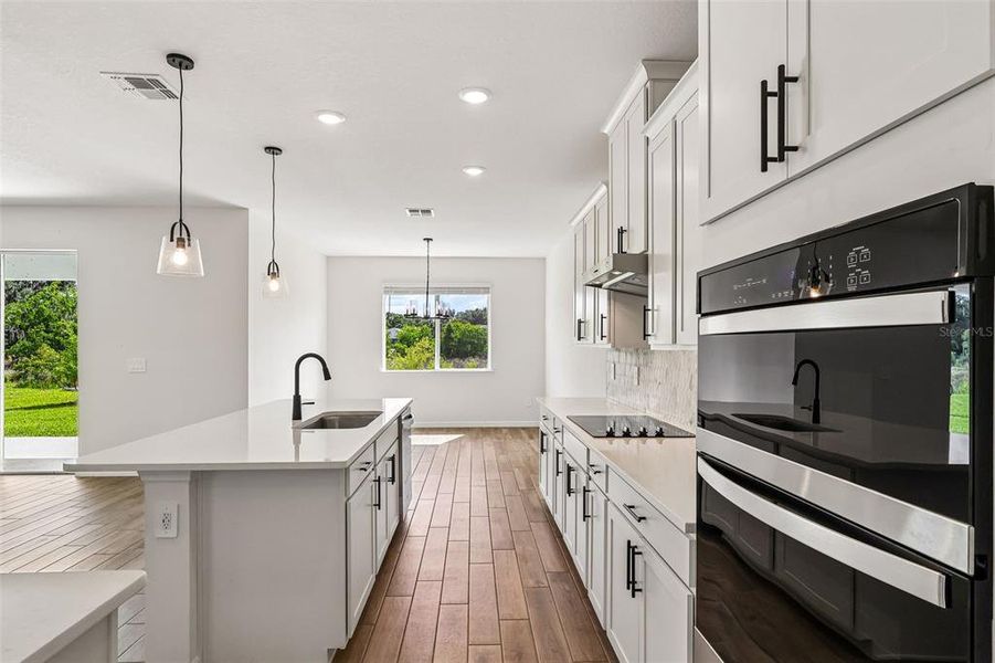Furnished interior view inside a new home in The Grove at Stuart Crossing - Signature Series, Bartow (Image 9).