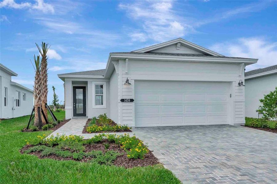 Front exterior of a new home in Cresswind at Lake Harris, Tavares, FL, highlighting curb appeal (Image 25).