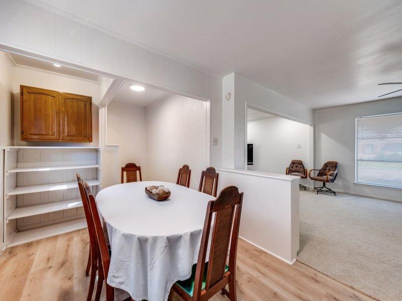 Dining space featuring light wood-style floors Dining space featuring light wood-style floors