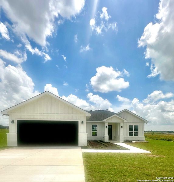 Front exterior of a new home in , La Vernia, TX, highlighting curb appeal (Image 29). Front exterior of a new home in , La Vernia, TX, highlighting curb appeal (Image 29).