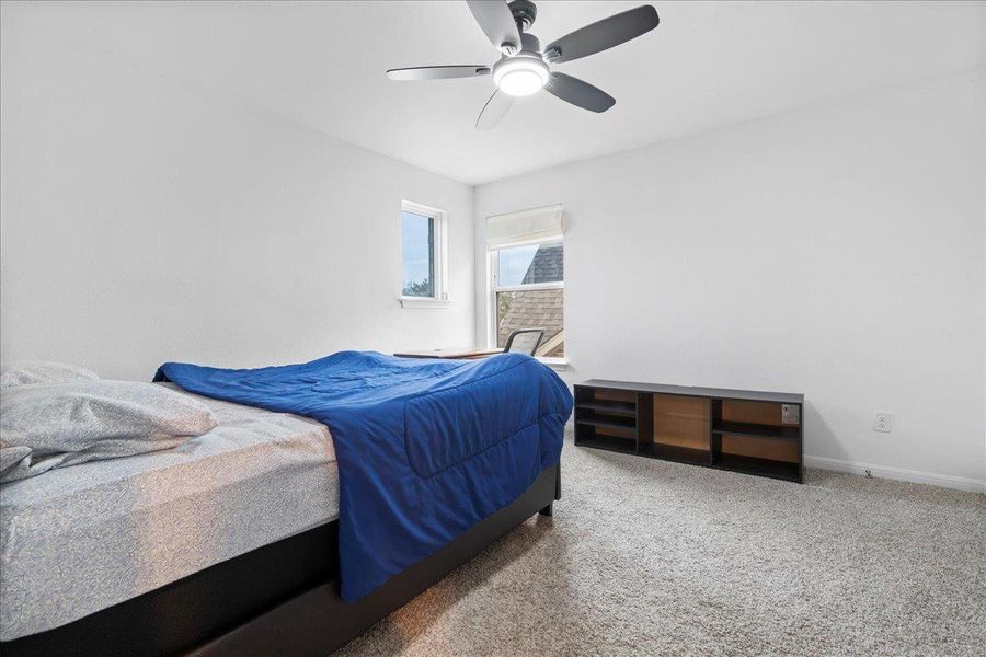 Bedroom featuring carpet flooring and ceiling fan