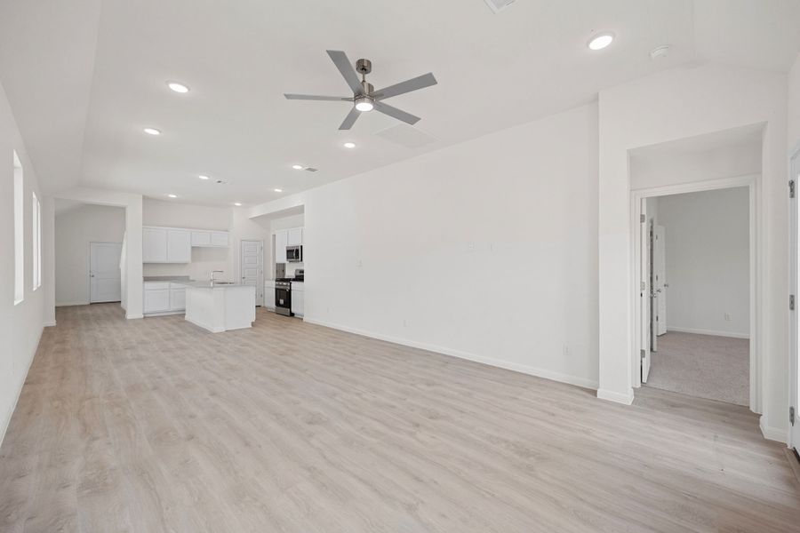 Living and Dining Area in the Elm home plan by Trophy Signature Homes – REPRESENTATIVE PHOTO