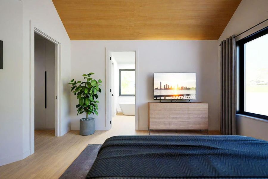 Primary Suite with vaulted wood ceiling, large picture window, and a spa-like ensuite bathroom. Primary Suite with vaulted wood ceiling, large picture window, and a spa-like ensuite bathroom.