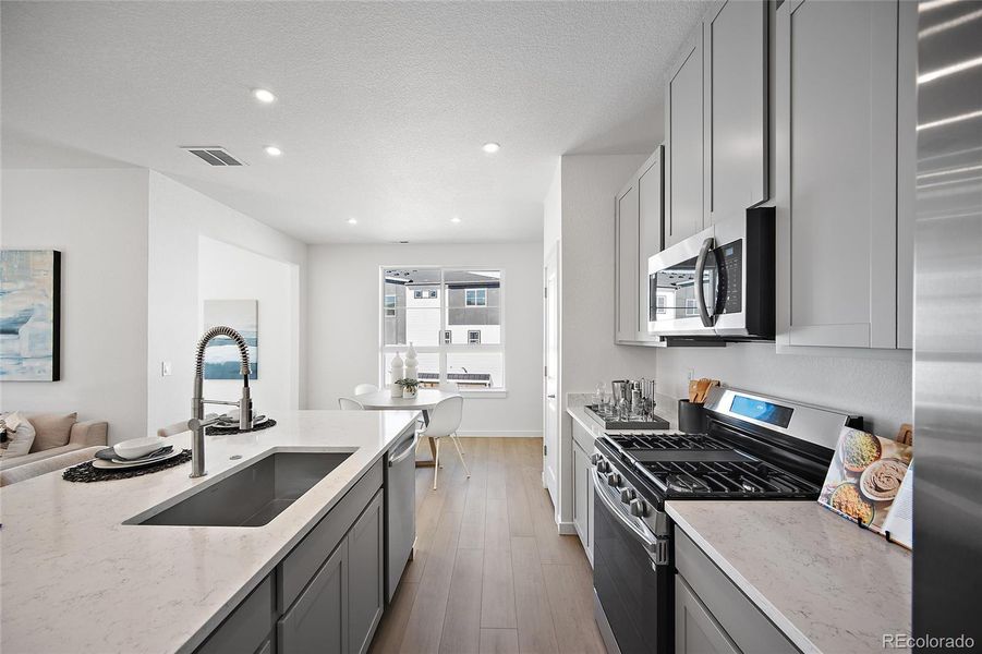 Furnished interior view inside a new home in The Commons at Victory Ridge, Colorado Springs (Image 11).