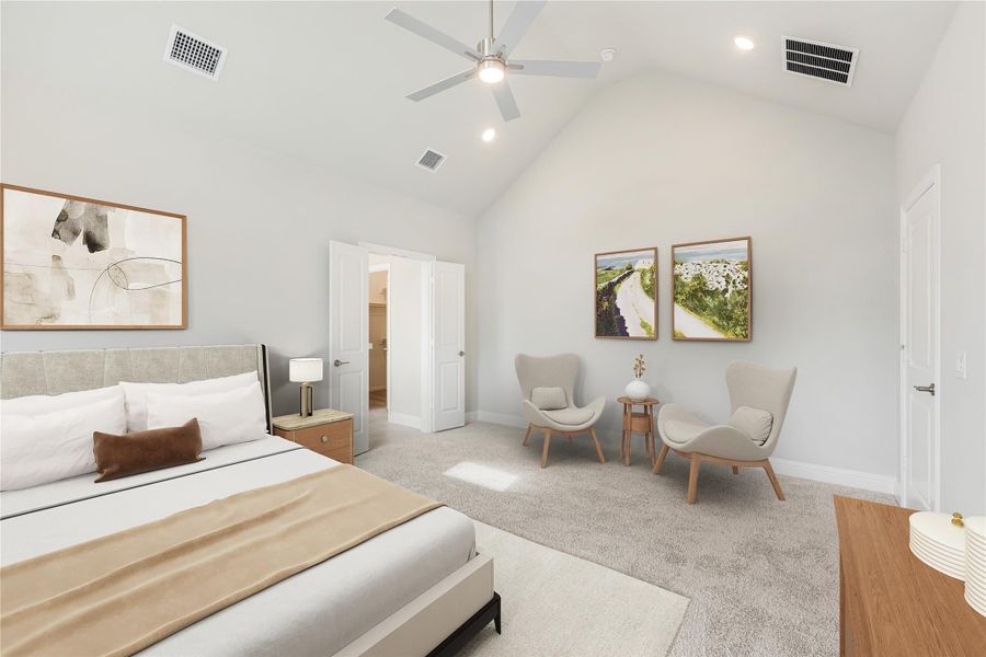 Spacious bedroom with vaulted ceiling, ceiling fan, sitting area, and carpet flooring