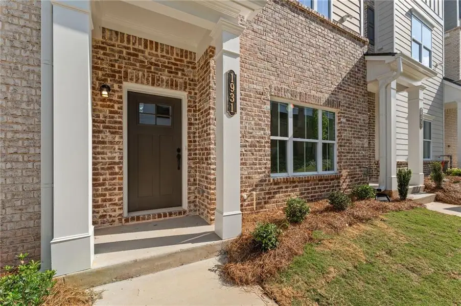 Exterior details and patio area of a home in Townes at South Main, Kennesaw (Image 4).