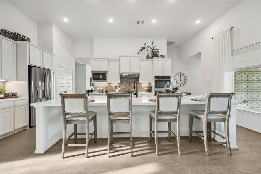 Gourmet kitchen with large island (*Photo not of actual home and used for illustration purposes only.)