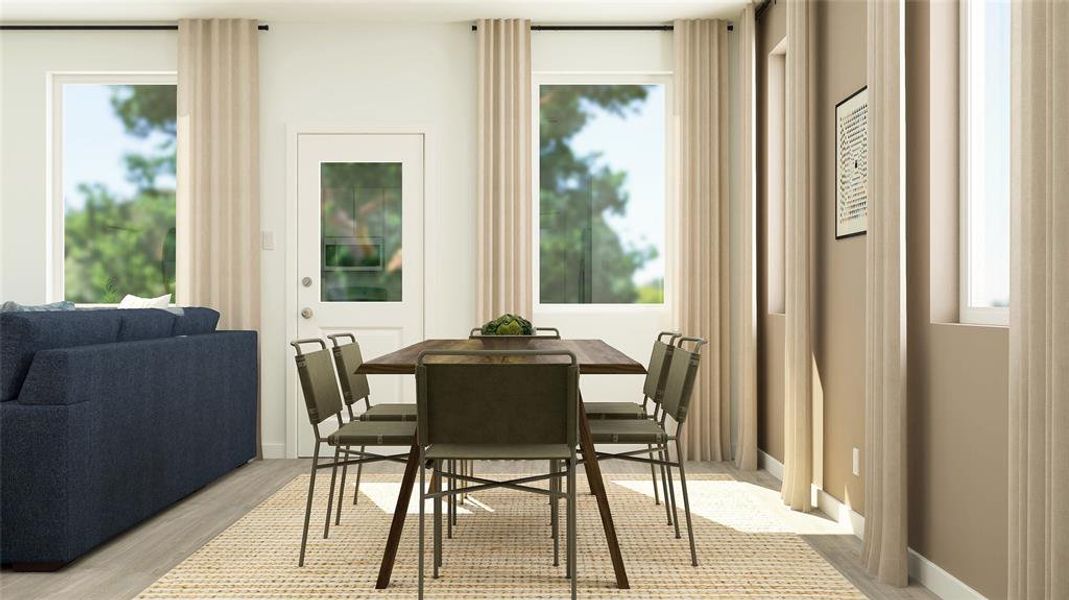 Dining room with light wood-type flooring and baseboards