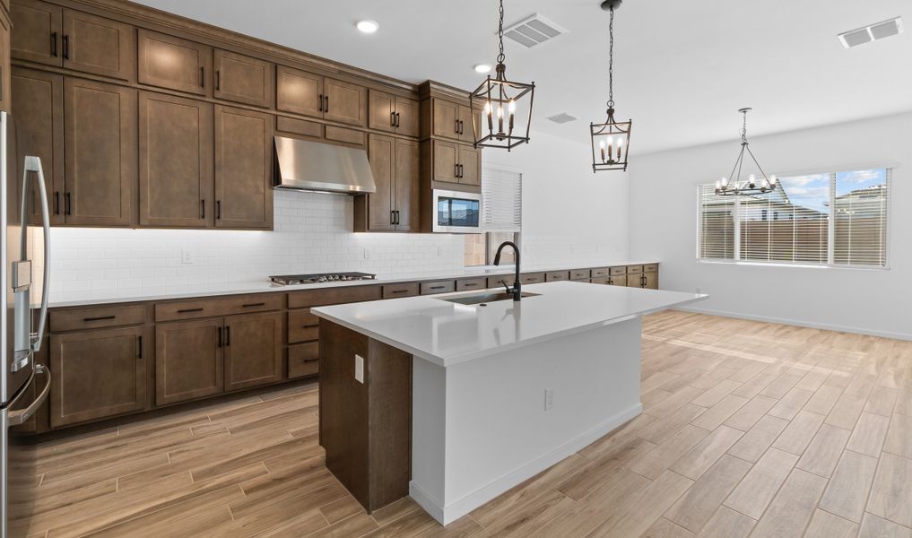 Kitchen with island and pendant lighting