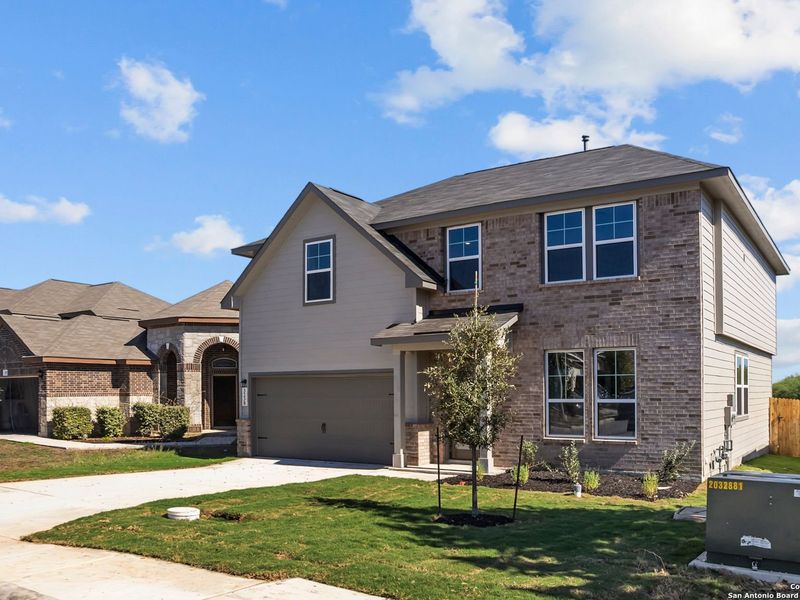 Front exterior of a new home in Horizon Pointe, Converse, TX, highlighting curb appeal (Image 2). Front exterior of a new home in Horizon Pointe, Converse, TX, highlighting curb appeal (Image 2).