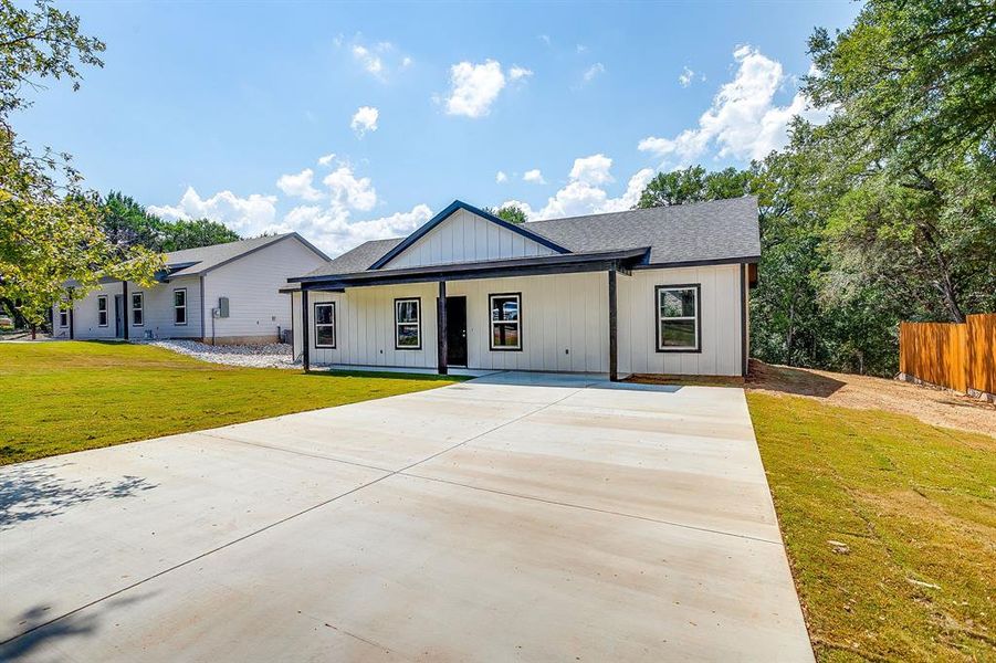 Front exterior of a new home in , Rio Vista, TX, highlighting curb appeal (Image 1). Front exterior of a new home in , Rio Vista, TX, highlighting curb appeal (Image 1).