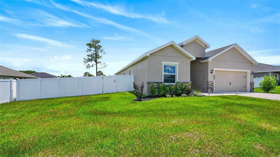 Front exterior of a new home in Silver Springs Shores, Ocala, FL, highlighting curb appeal (Image 2). Front exterior of a new home in Silver Springs Shores, Ocala, FL, highlighting curb appeal (Image 2).