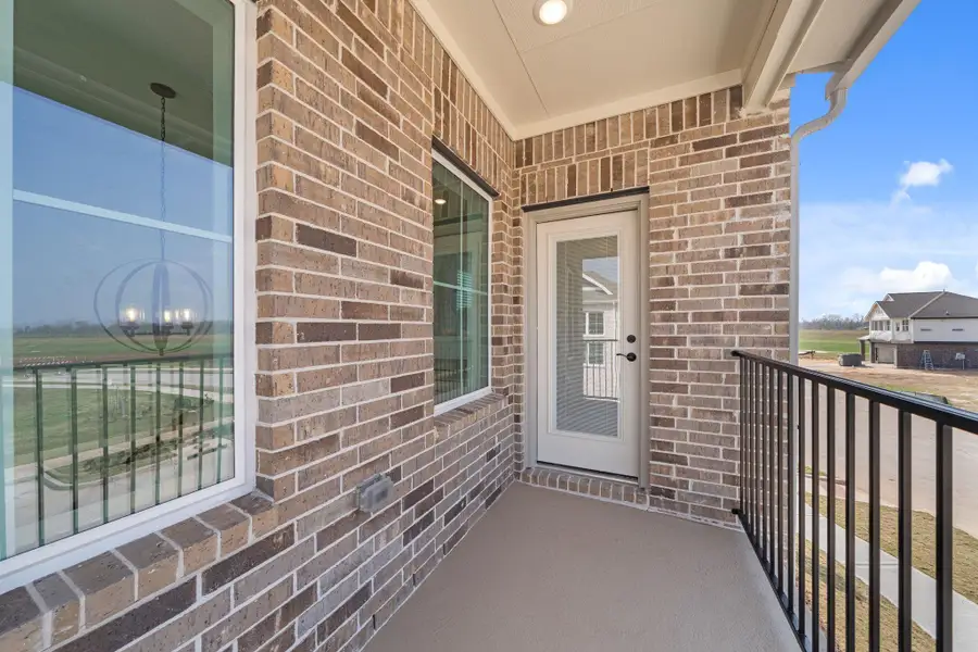 Exterior details and patio area of a home in Sienna, Missouri City (Image 21).