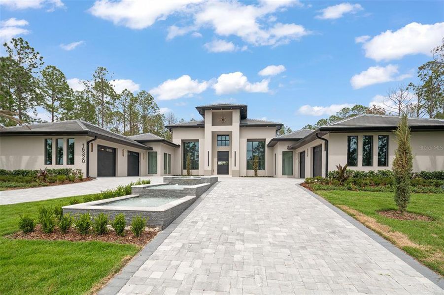 Front exterior of a new home in , Montverde, FL, highlighting curb appeal (Image 29).