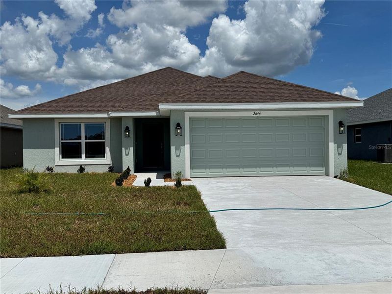 Front exterior of a home in the Watercress Cove community, located in North Port, FL (Image 8).