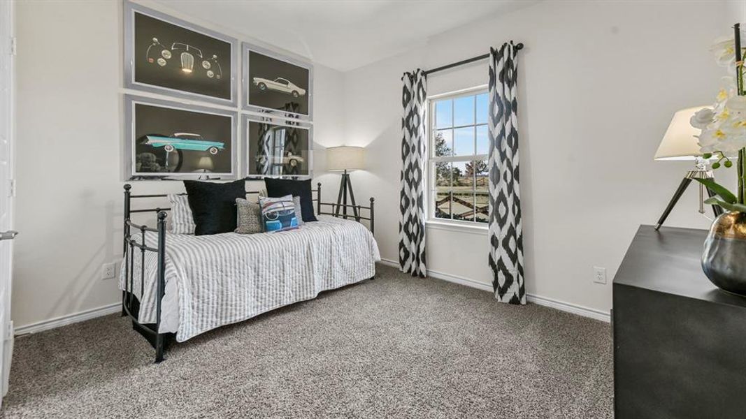 Carpeted room featuring a single window with grid panes and white trim