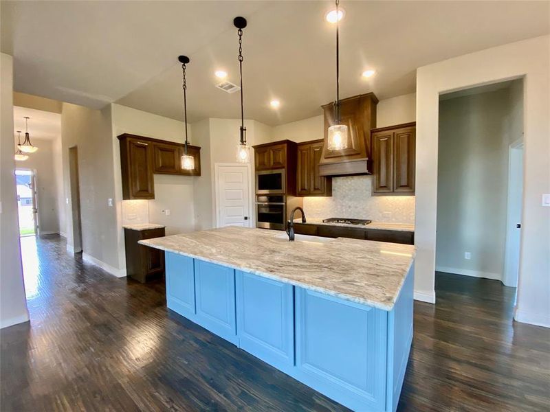 Huge kitchen island is custom Polaris Blue accent color (we can repaint if needed)