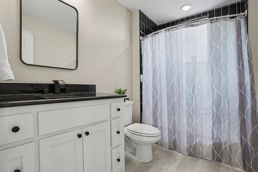 2nd Floor Full bath with vanity and a shower with shower curtain