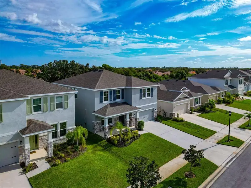 Front exterior of a new home in , Apollo Beach, FL, highlighting curb appeal (Image 18).