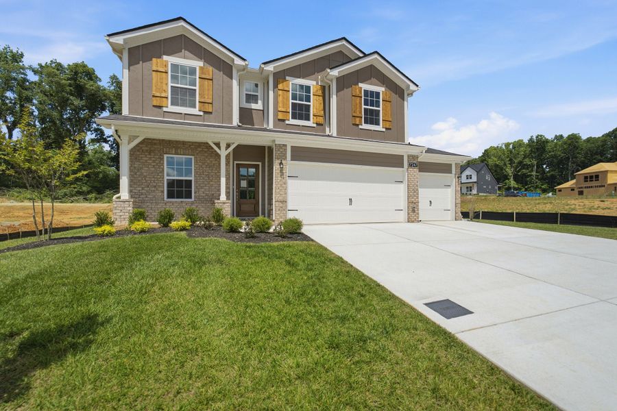 Front exterior of a new home in Brush Creek, Fairview, TN, highlighting curb appeal (Image 28). Front exterior of a new home in Brush Creek, Fairview, TN, highlighting curb appeal (Image 28).