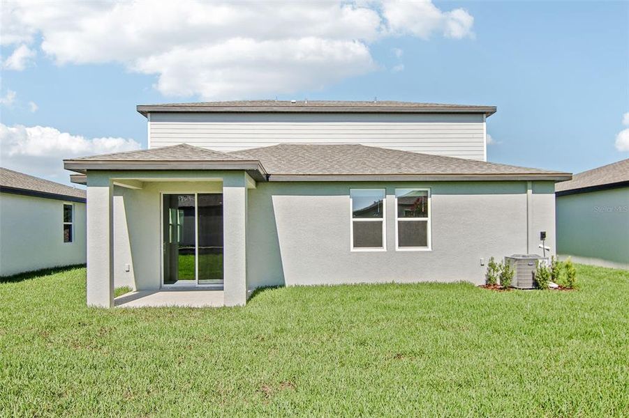Front exterior of a new home in Two Rivers - Classic Series, Zephyrhills, FL, highlighting curb appeal (Image 16).