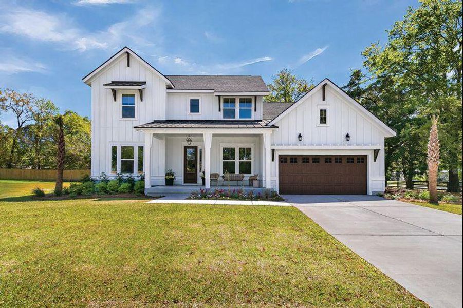 Front exterior of a new home in , Johns Island, SC, highlighting curb appeal (Image 1). Front exterior of a new home in , Johns Island, SC, highlighting curb appeal (Image 1).