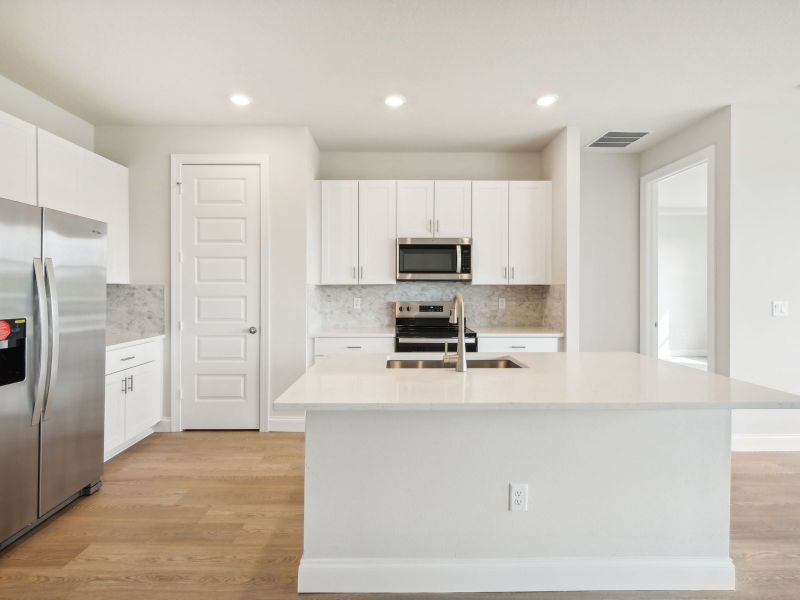 Kitchen in the Bergamo floorplan at 11306 NW Firefly Court