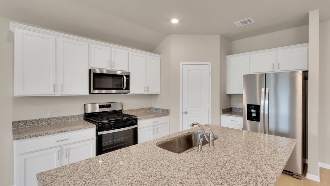 Furnished interior view inside a new home in Bar W Ranch, Leander (Image 4).