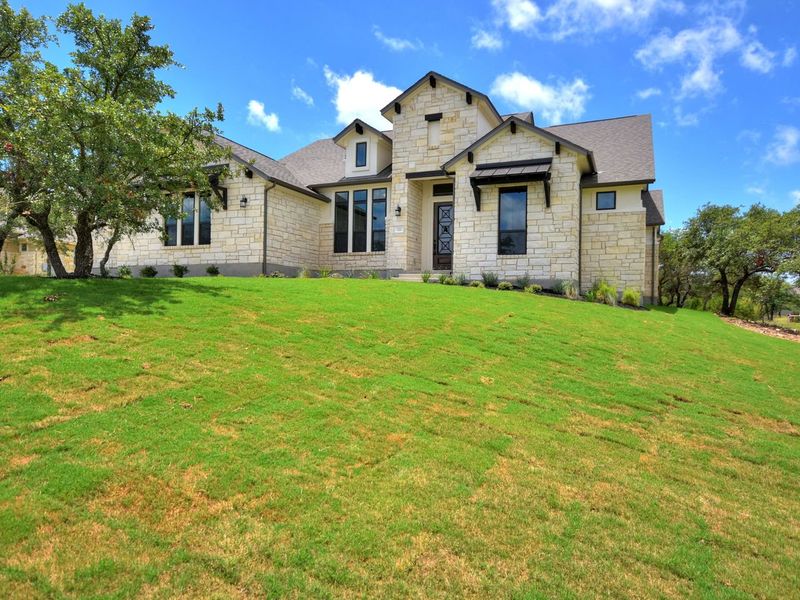 Representative exterior photo of a completed home built from the San Simeon I by Giddens Homes in Clearwater Ranch, Liberty Hill, TX (Image 34).