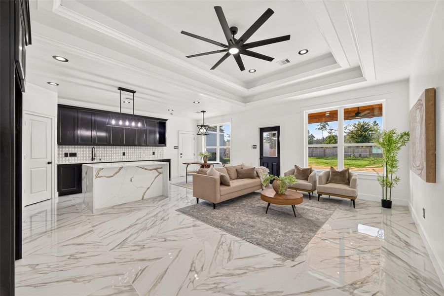 Open sightlines connect the living room directly to the custom kitchen, creating the perfect space for entertaining.