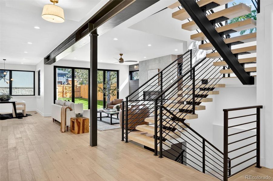 Floating slab wood stairs & mono-stringer design