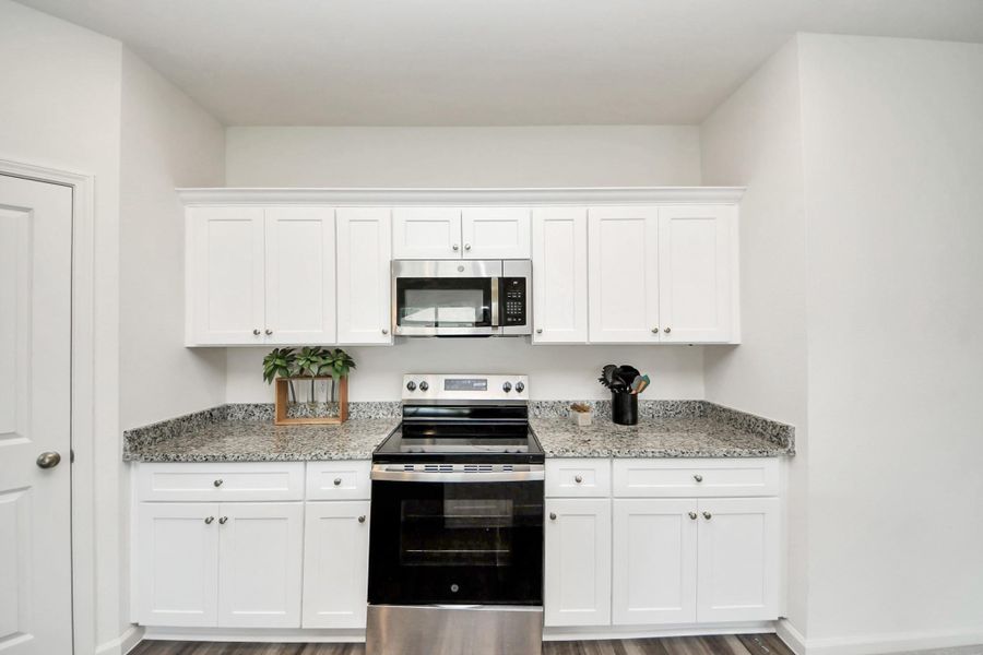 Ample cabinetry can be found in this modern kitchen
