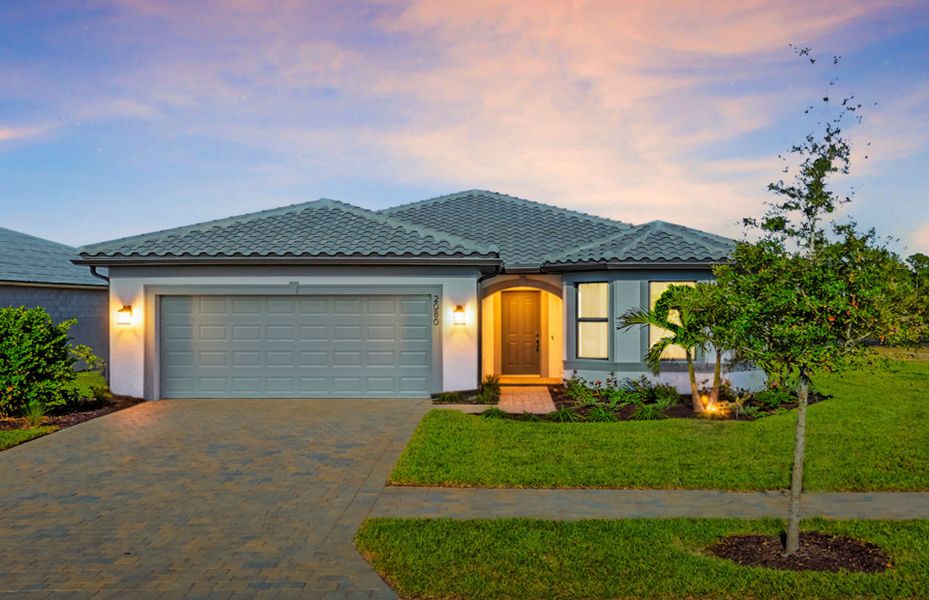 Front exterior of a new home in Terreno, Naples, FL, highlighting curb appeal (Image 2).