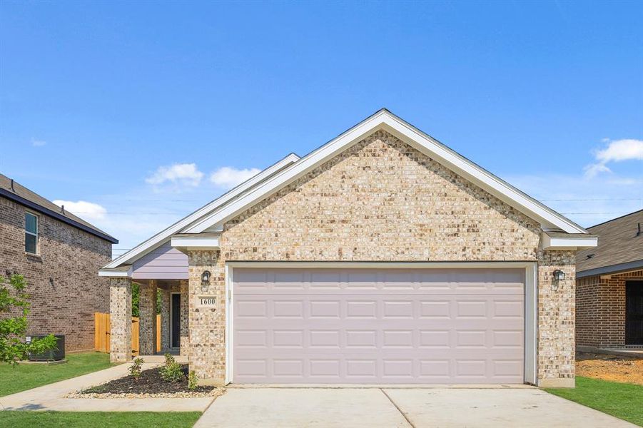 Front exterior of a new home in Christian Meadows, Ennis, TX, highlighting curb appeal (Image 14).