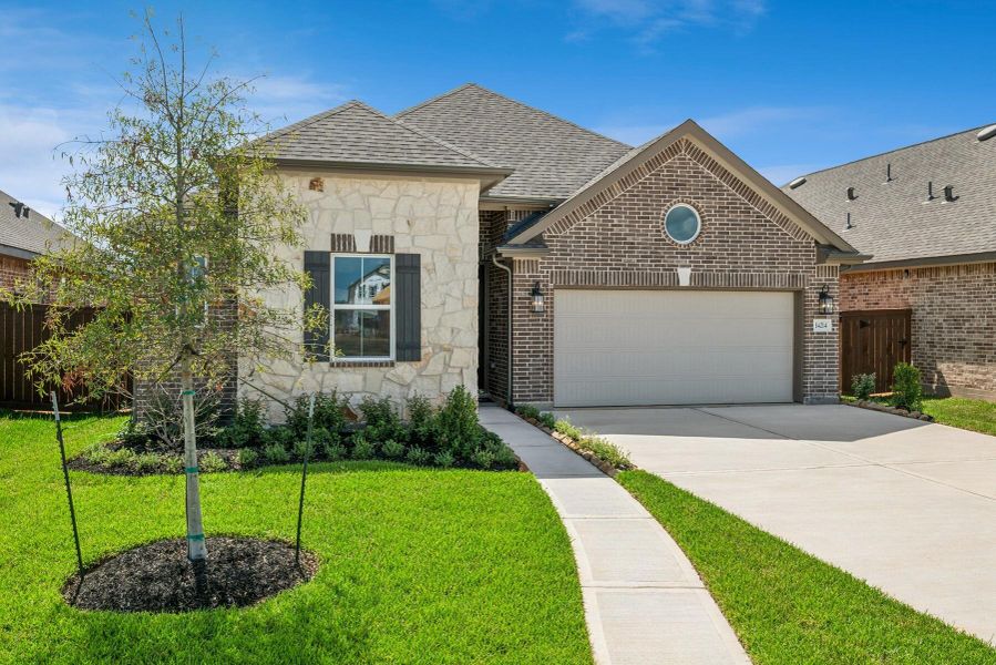 Front exterior of a new home in Harvest Pointe, Needville, TX, highlighting curb appeal (Image 2).