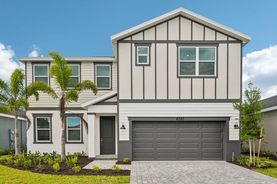 Front exterior of a new home in Brystol at Wylder - Reserve Series, Port St. Lucie, FL, highlighting curb appeal (Image 1).