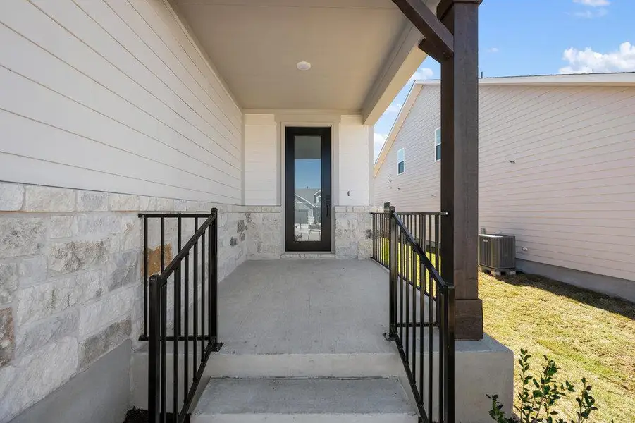 Exterior details and patio area of a home in Cannon Ranch, Dripping Springs (Image 3).
