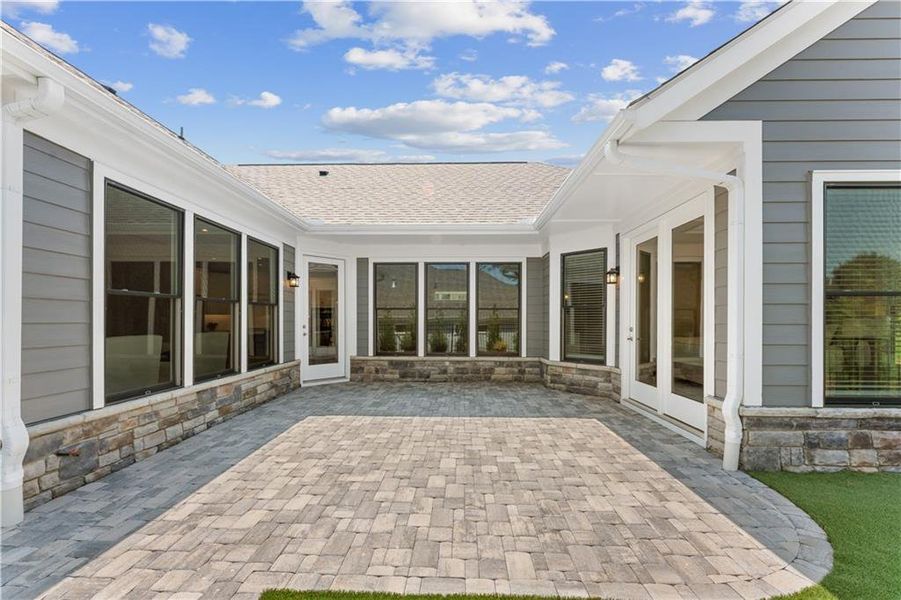 Exterior details and patio area of a home in The Courtyards at Post Road, Cumming (Image 3).