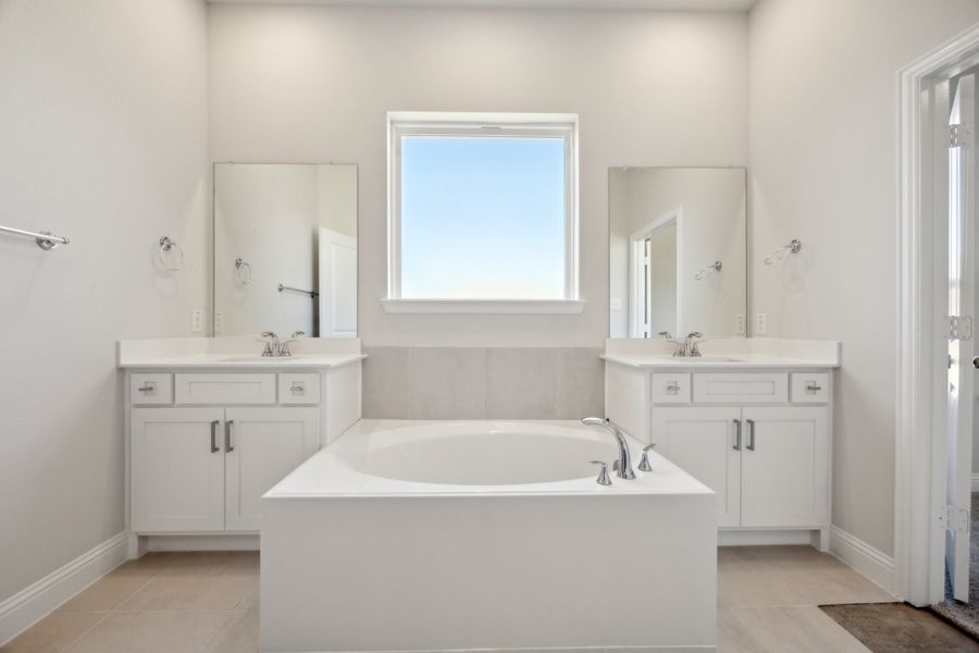 Representative furnished interior of a home built from the Waverly III by Megatel Homes in Bellagio, Forney (Image 6).