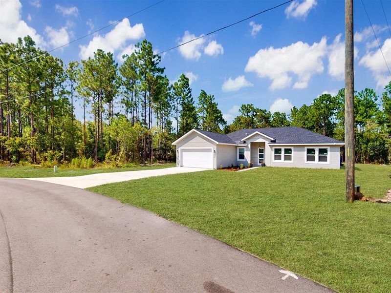 Front exterior of a new home in , Ocala, FL, highlighting curb appeal (Image 19). Front exterior of a new home in , Ocala, FL, highlighting curb appeal (Image 19).
