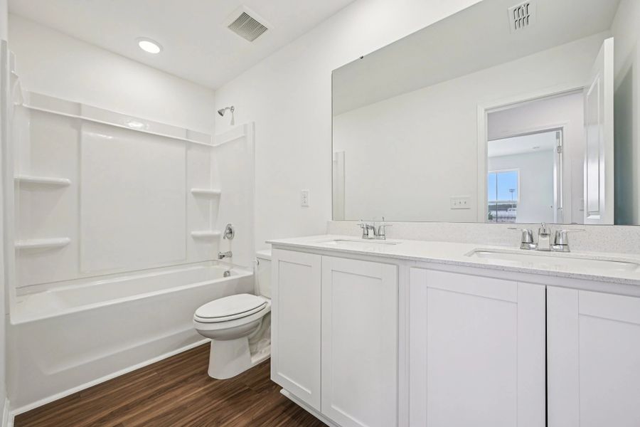 Bath 2 - Stylish finishes and dramatic contrast throughout.