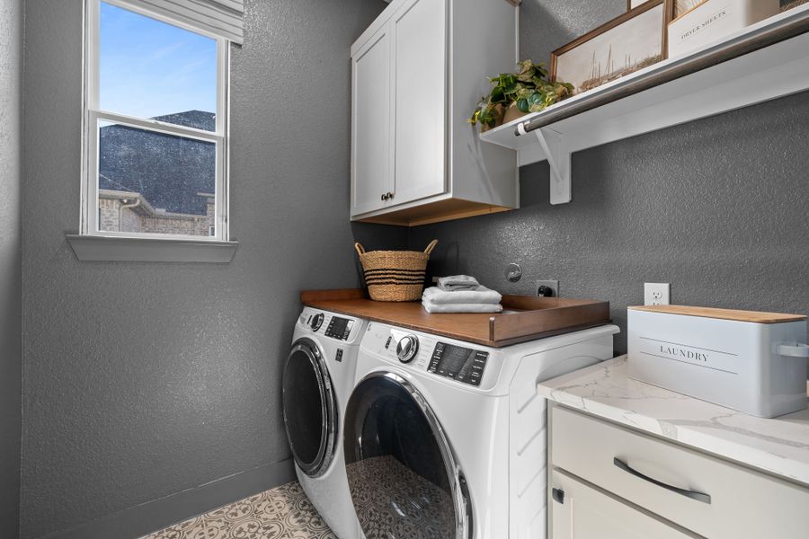 Representative furnished interior of a home built from the Bonneville by Chesmar Homes in University Heights, Round Rock (Image 15).