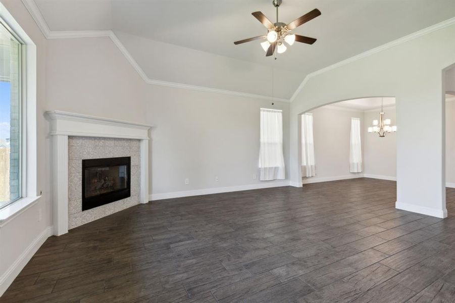 Open concept makes a large statement throughout the family & formal dining room's flooring & loft like ceiling. Open concept makes a large statement throughout the family & formal dining room's flooring & loft like ceiling.
