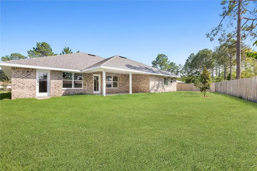 Exterior details and patio area of a home in Palm Coast, Palm Coast (Image 2).