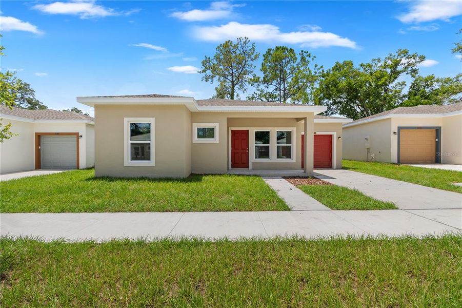 Front exterior of a new home in , Tampa, FL, highlighting curb appeal (Image 1). Front exterior of a new home in , Tampa, FL, highlighting curb appeal (Image 1).