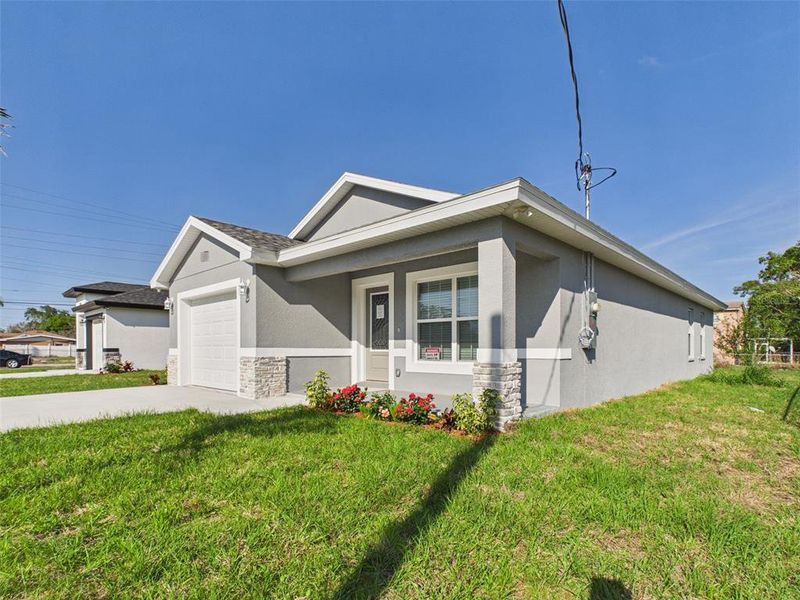 Front exterior of a new home in , Lakeland, FL, highlighting curb appeal (Image 17).