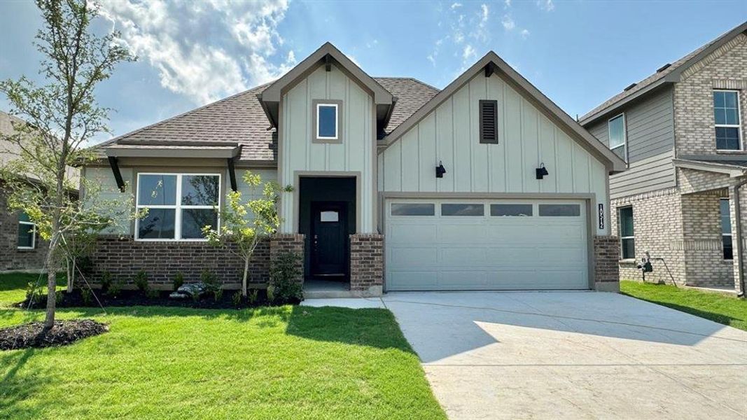 Front Elevation - D.R. Horton's Kingbird Floorplan Elevation J - All Home and community information, including pricing, included features, terms, availability and amenities, are subject to change at any time without notice or obligation. All Drawings, pictures, photographs, video, square footages, floor plans, elevations, features, colors and sizes are approximate for illustration purposes only and will vary from the homes as built.