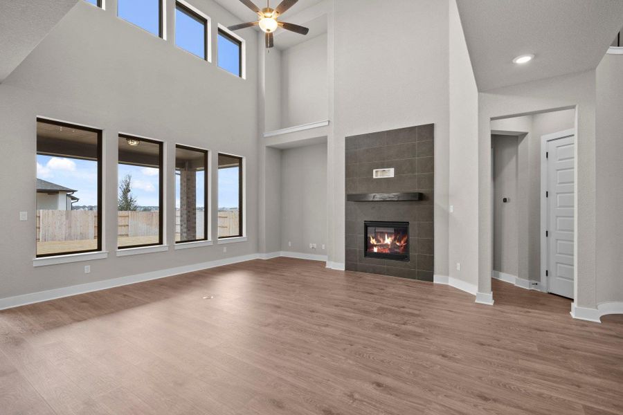 Family Room with soaring ceiling & fireplace