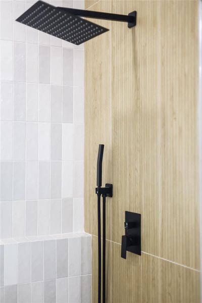 Room details featuring a tile shower